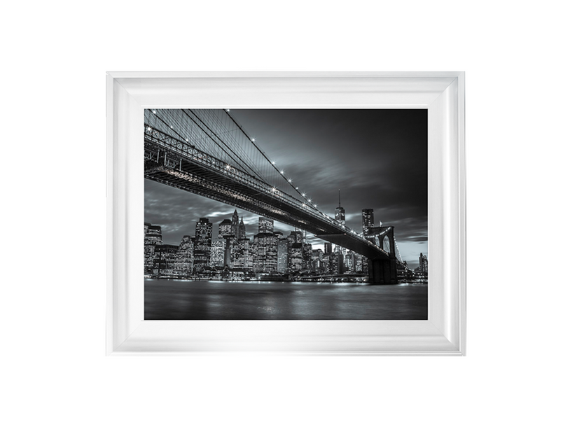 Brooklyn Bridge and lower Manhattan skyline at dusk