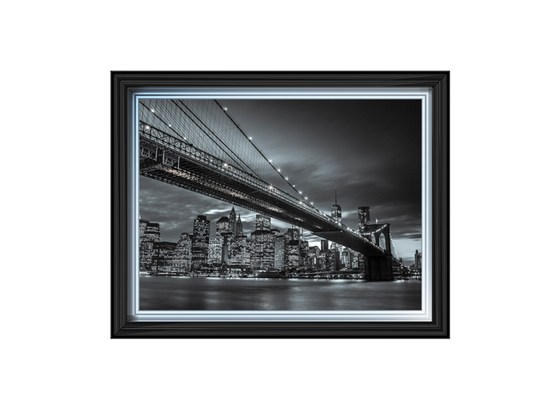 Brooklyn Bridge and lower Manhattan skyline at dusk