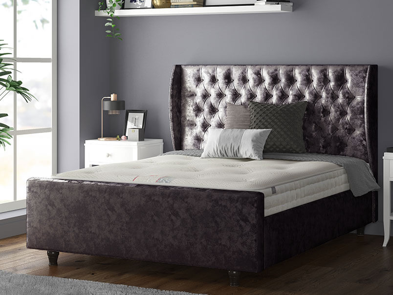 Aurora Chesterfield Wing Bed with Matching Buttons and Wooden Feet in Crushed Velvet Amethyst