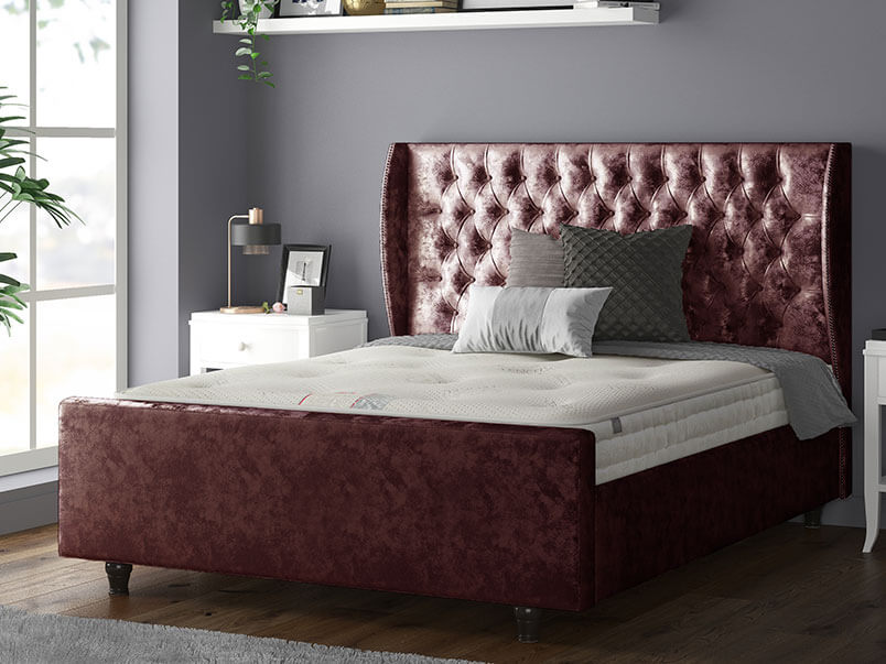 Aurora Chesterfield Wing Bed with Matching Buttons and Wooden Feet in Crushed Velvet Mulberry