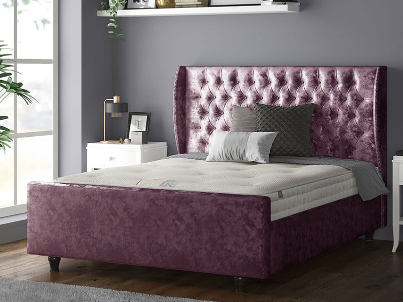 Aurora Chesterfield Wing Bed with Matching Buttons and Wooden Feet in Crushed Velvet Mulberry