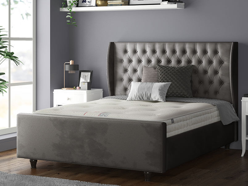 Aurora Chesterfield Wing Bed with Matching Buttons and Wooden Feet in Plush Velvet Royal Blue