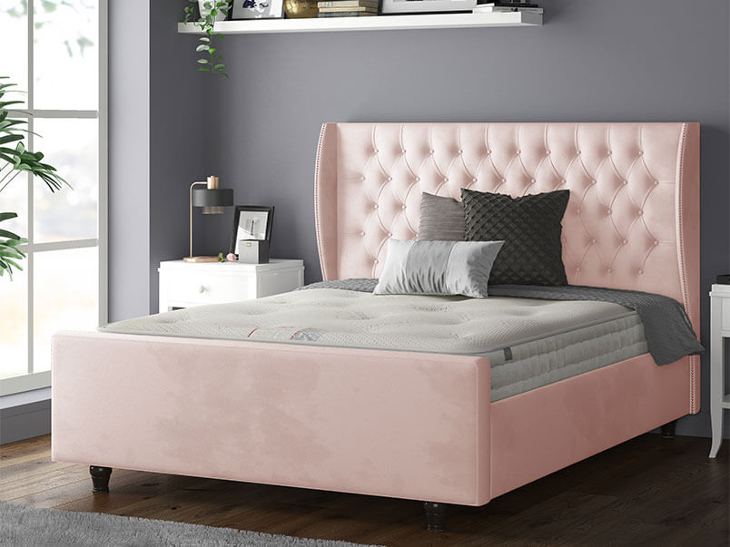 Aurora Chesterfield Wing Bed with Matching Buttons and Wooden Feet in Plush Velvet Pink